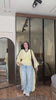 AT Store lifestyle - yellow blouse with light blue wide pants